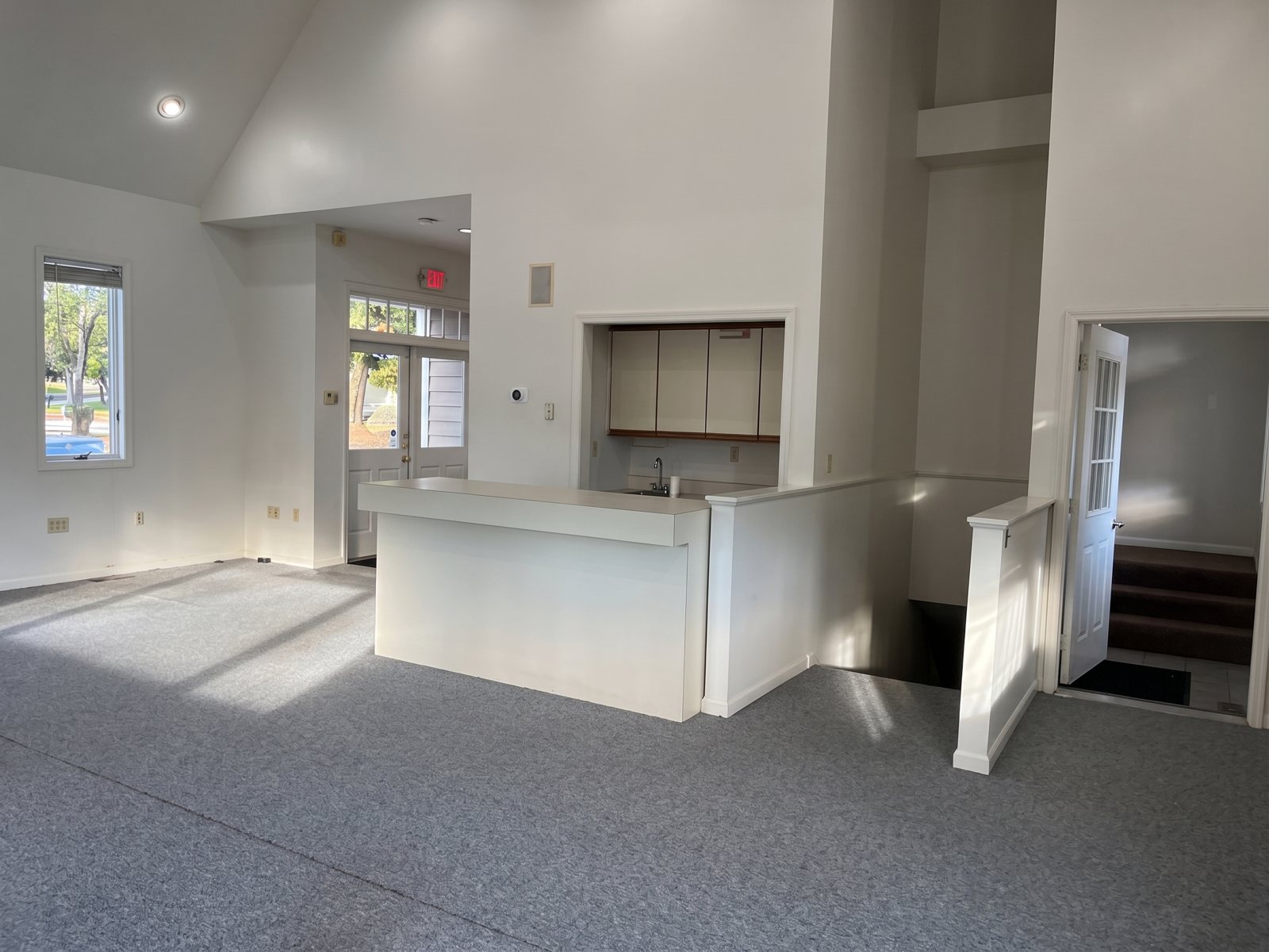 First floor interior with counter, stair and vaulted ceiling
